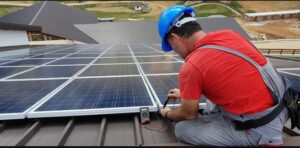Man installing solar panels 
