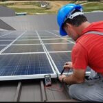 Man installing solar panels